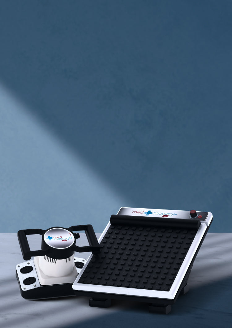 Two MedMassager body massagers with handles and textured platforms on a blue surface, soft shadow in background.