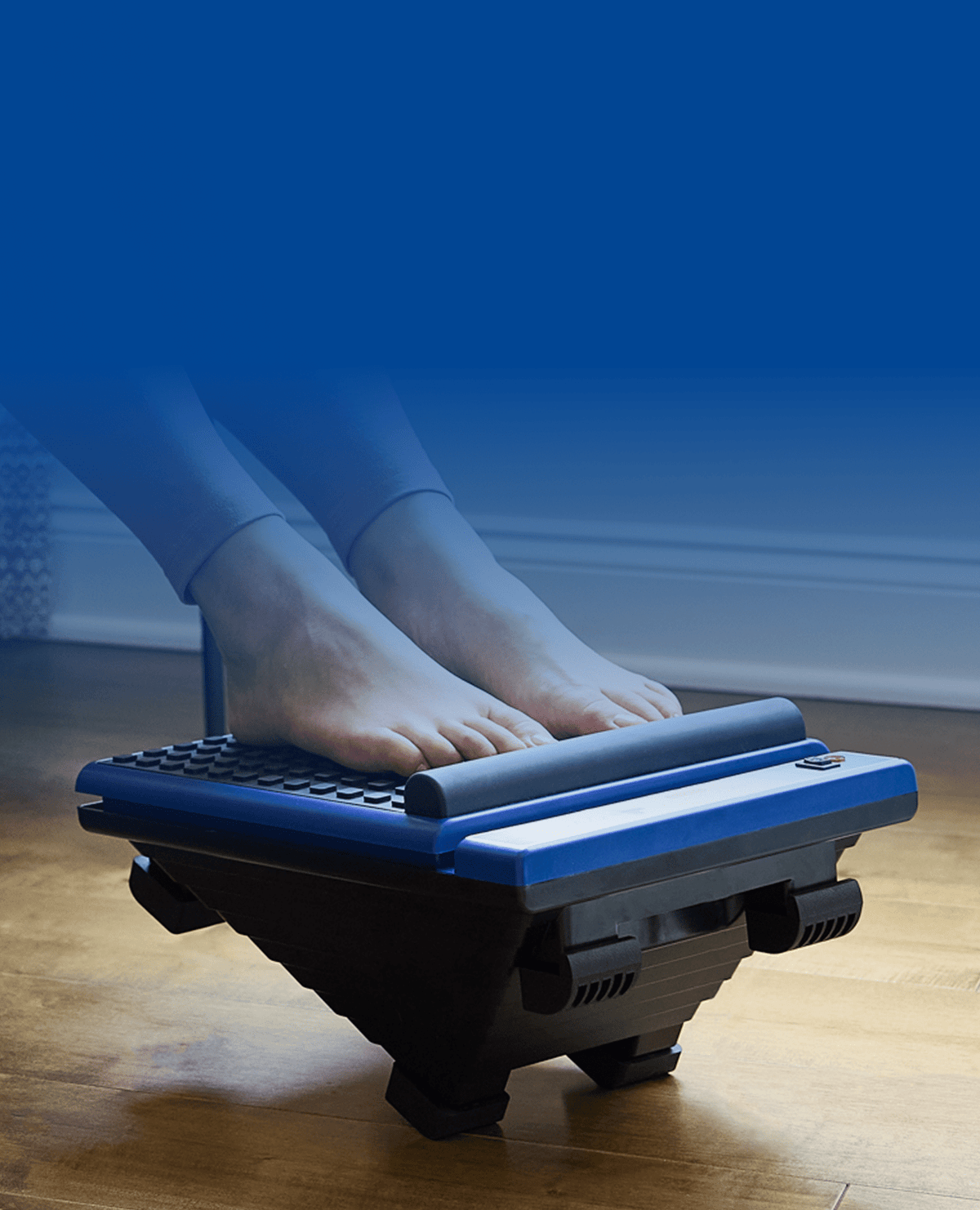 Feet on a blue and black foot massager on a wooden floor, with blue gradient background. Ideal for MedMassager product listings.