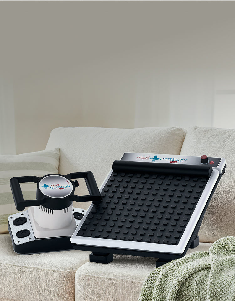 MedMassager body massager and foot massager displayed on a beige sofa, showing handheld and textured foot massage devices.